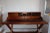 Wooden vintage desk with leather top. HISTORY Campaign furniture originated in the 18th century, designed for military...