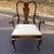 (10 Side Chairs + 2 Armchairs) A substantial and elegant set of twelve classic Queen Anne dining chairs, crafted in solid...