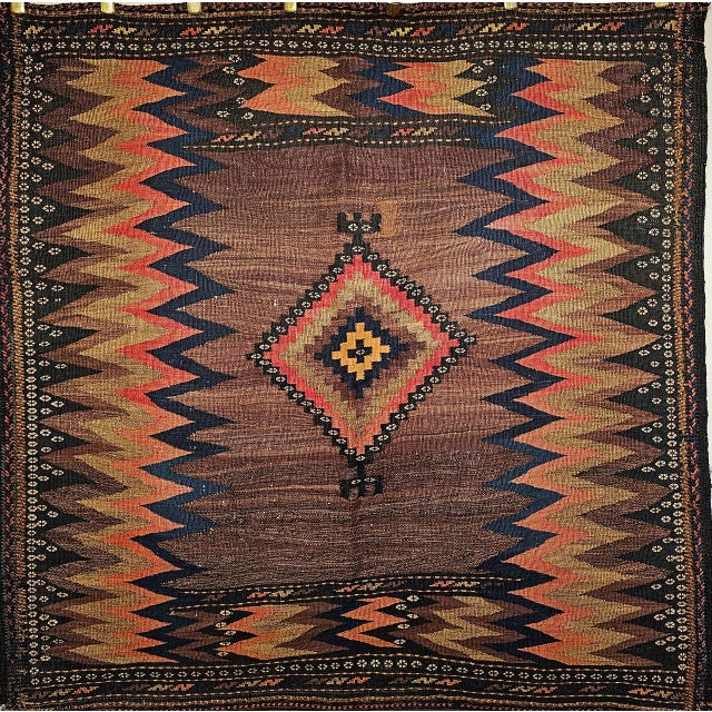 Woven for use rather than trade, this early 20th century Persian Tribal Sofreh kilim from the Qashqai weavers of Southwest...