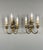 Elegant pair of brass wall sconces with finely crafted decoration and three lights. Each sconce features a curved...