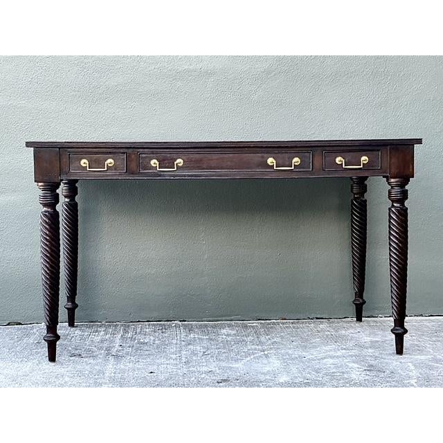 This magnificent writing desk perfectly captures the refined, adventurous spirit of British Colonial design, making it a...