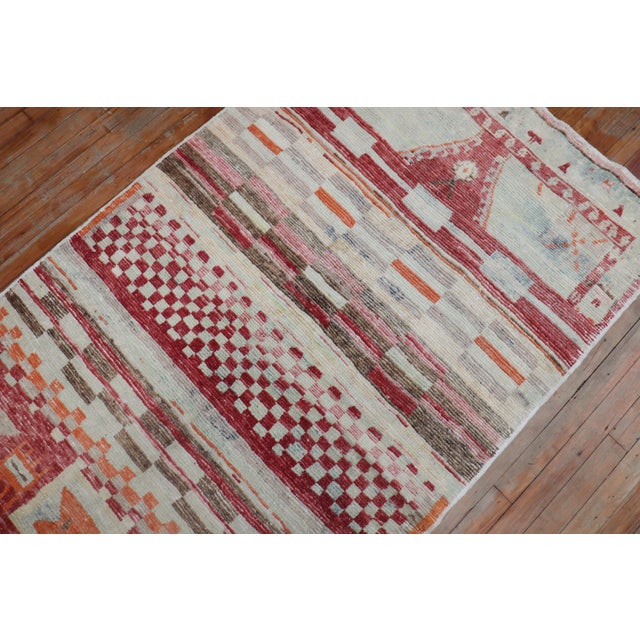 An abstract midcentury Turkish Anatolian rug with a brick red field with accents in orange and brown. Size: 3'8” x 6'6”...