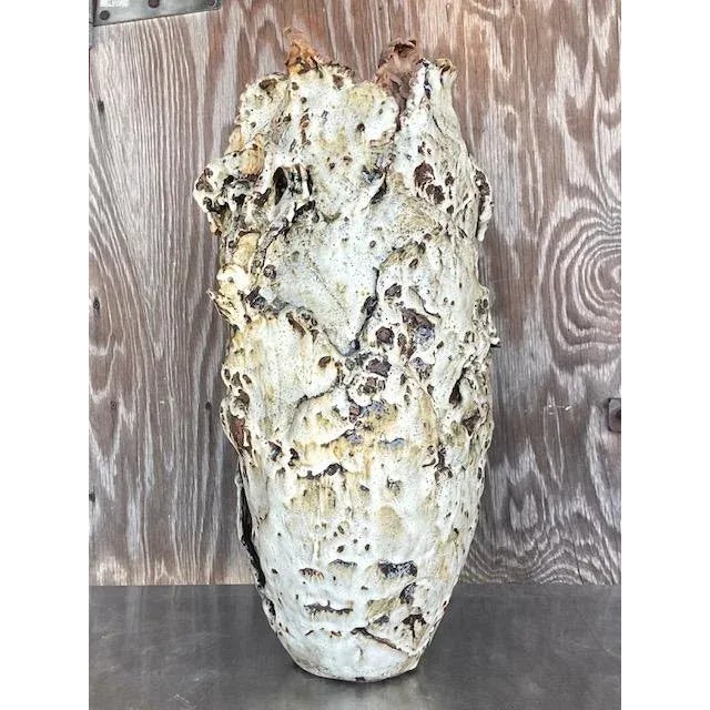 Add a touch of vintage boho artistry to your space with this stunning monumental studio pottery vase. Expertly slab-built,...