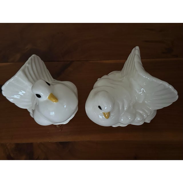 Pair of 2 vintage dove “love birds”figurines. Ceramic with a glossy white glaze and hand painted yellow beaks and black...