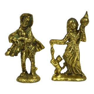 Antique Finished Brass Bagpipe Player and Maiden With Distaff and Cat Figurines - Set of 2 For Sale