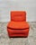 A modular sofa composed of four individual elements dating back to the 1980s. upholstered in soft, dramatic orange bouclé...