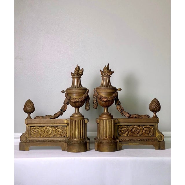 Fabulous pair of antique urn form patinated gilt bronze chenets or andirons, Louis XVI style, France, 19th century....