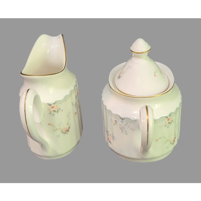 This vintage set from Mikasa is a beautiful addition to any collection. The delicate Petite Roselle design on the sugar...