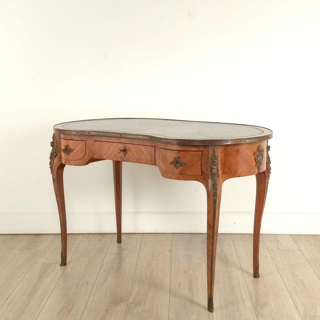 A French Louis XV Style kidney-shaped desk with an insert leather top, circa 1880. 24.5" knee.