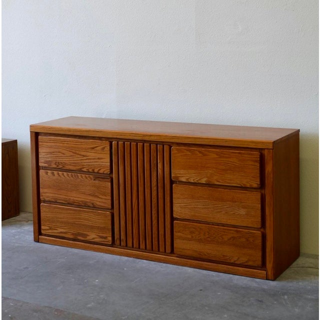 Beautifully crafted solid oak dresser from Pure Simple. This piece features a rich wood grain finish, 9 spacious drawers,...