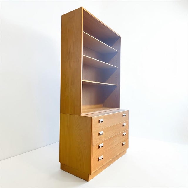 This is a special, high-quality piece of danish mid-century furniture from the 1960s. A bookcase/cabinet made primarily of...