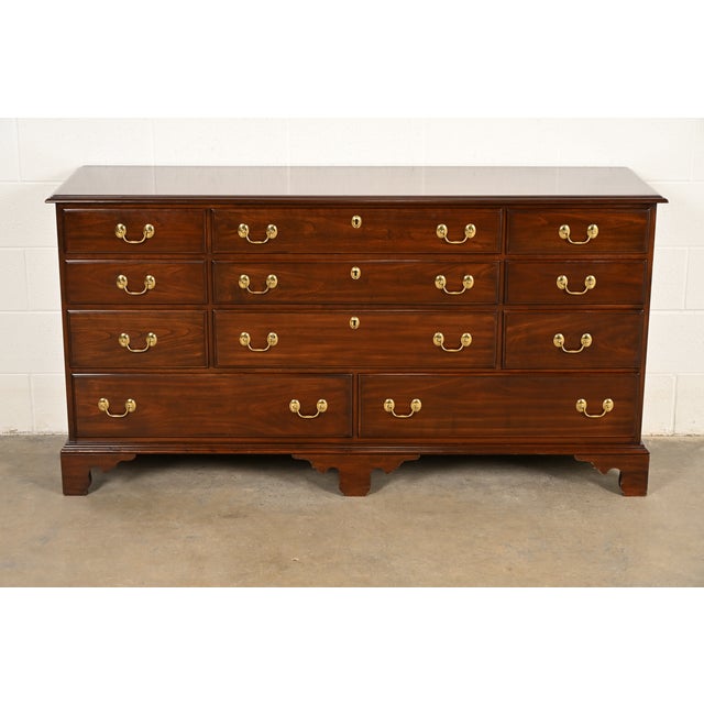 A beautiful Georgian or Chippendale style eleven-drawer dresser, chest of drawers, or credenza By Harden Furniture USA,...