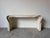 This striking vintage console table showcases an elegant coastal organic design inspired by the iconic work of Betty...