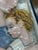 Madonna and Child, created by Tosin Tarcisio in 1930. Hand-painted ceramic, mounted on a wooden panel, with a metal halo...