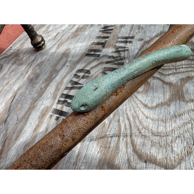 Vintage heavy solid iron and steel coffee table featuring a striking bronze snake motif in the style of Giacometti....