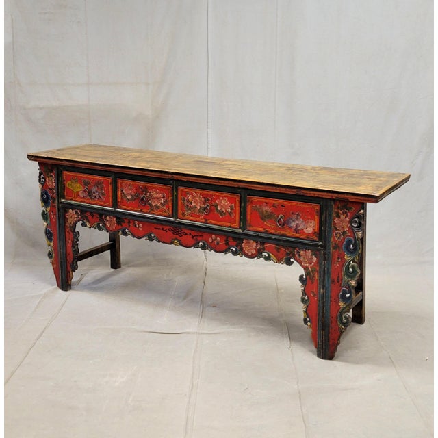 An exceptional antique early 20th century (likely 1920s-1940s) four drawer altar or console table from China. The front is...