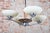 This elegant and timeless four-arm chandelier originating from the 1920s represents an exceptional example of the Art Deco...