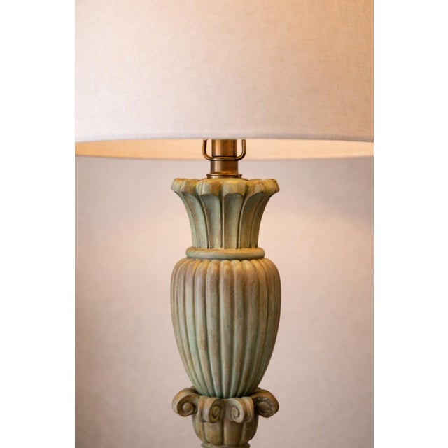 Mid-20th century Neoclassical urn-form table lamp with sculptural fluting and an aged verdigris finish. Recently refreshed...