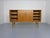 Large, very rare oak sideboard from the 1960s. Four doors, with 7 drawers and a large compartment in the middle. Right...