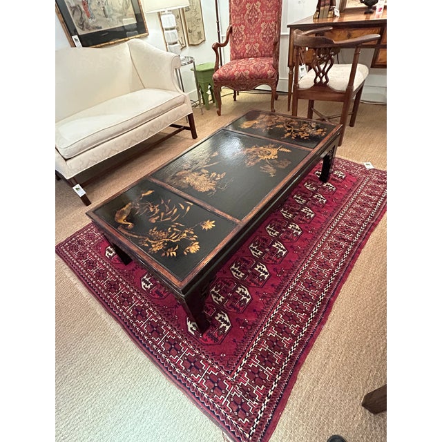 Elegant black and gold lacquer Chinoiserie style coffee table with just the right cracquelure to give it character and...