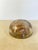 Substantial vintage resin dome paperweight encasing a genuine natural crystal/mineral specimen — rusty amber and rose-hued...