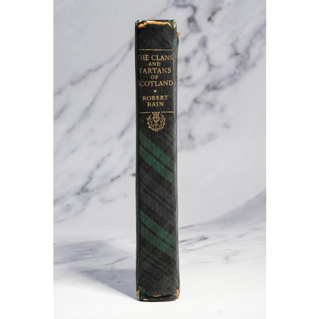A charming and highly collectible 1956 edition of The Clans and Tartans of Scotland by Robert Bain, an enduring reference...