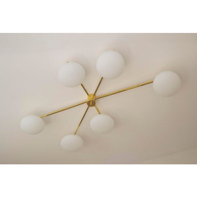 Dimensions: 100 x 160 x 25h cm handcrafted production and excellent workmanship completed with murano opalines. brass...