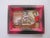 In "Your Move," two animated figures engage in a playful confrontation over a tabletop game, their expressions conveying a...
