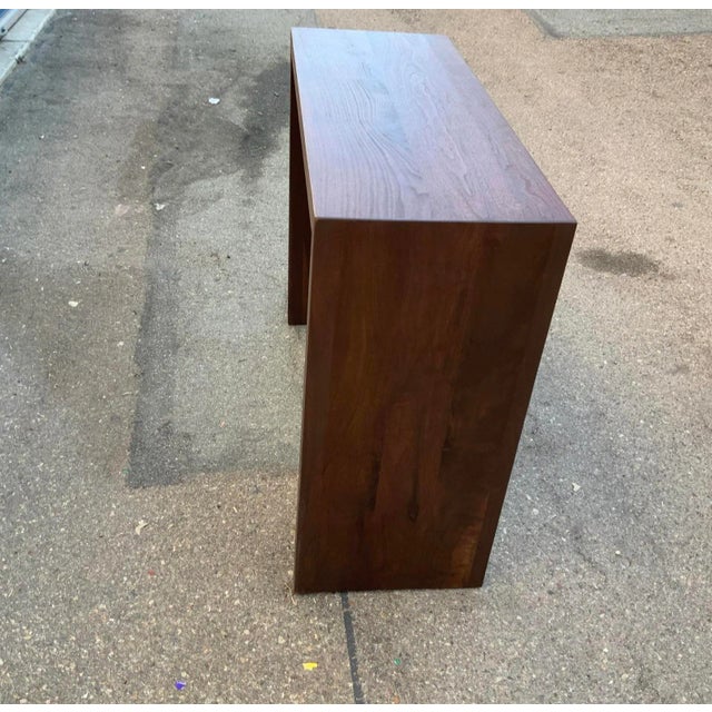 Mid century style solid walnut console. Console is finished in a light walnut/satin finish. The console is made of solid...