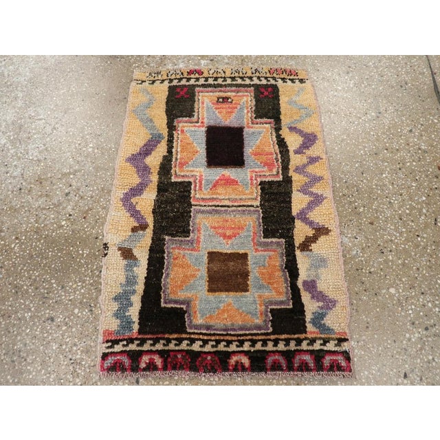 A vintage Turkish Anatolian throw rug handmade during the mid-20th century. Measures: 1' 7" x 2' 4"