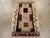 A vintage Turkish Anatolian throw rug handmade during the mid-20th century. Measures: 1' 7" x 2' 4"