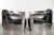 This industrial set of two black cowhide Aviator-style armchairs has a rugged look thanks to the sides, which are trimmed...