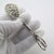A pair of small vintage sugar cube tongs, handcrafted in 800/000 silver in Italy between the 1970s and 1980s, reflecting...
