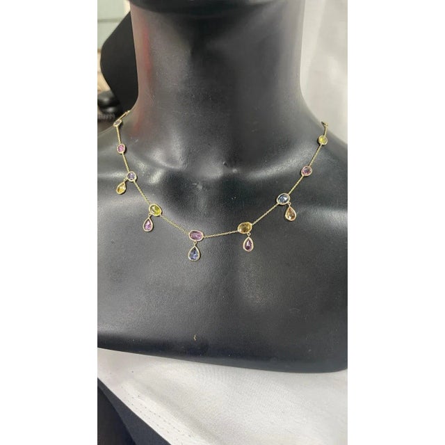 This is part of Chairish’s Fine Jewelry assortment. Multi Gemstone Necklace in 18K Gold studded with oval, pear cut...