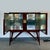 Splendid Mid-century bar cabinet made of noble woods, mercury mirror and brass inlays. Inside, glass and mirrors are...