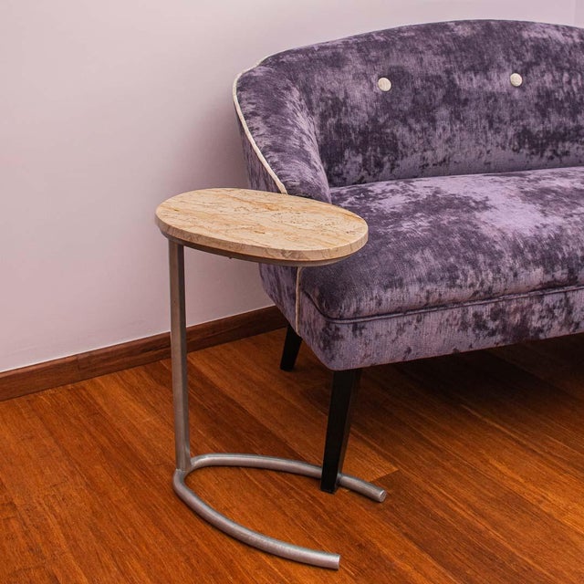 This side table features a polished beige marble top with soft veining in cream, sand, and taupe tones. Its minimalist...