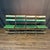 Antique French folding chairs from the 1920s: feature slatted green painted wood and metal frames. Great chair set indoors...