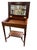 This late-19th-century flip-top dressing table—also known as a table de toilette, and sometimes functioning as a small...