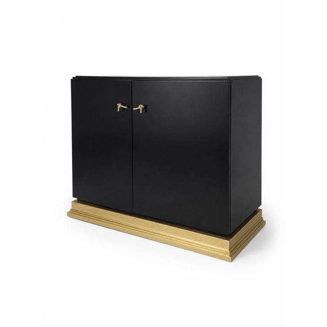 Elegant Baker Furniture black cabinet from the André Arbus Collection. This sophisticated two-door cabinet features a...