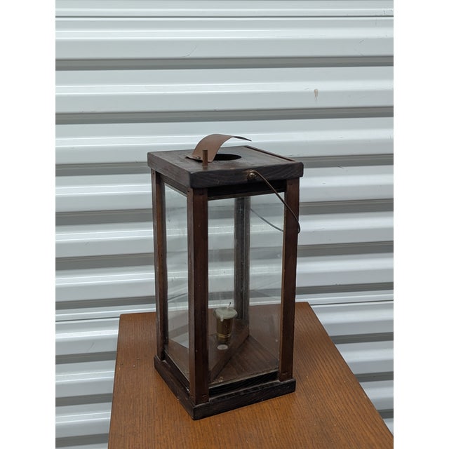 This handcrafted late-19th-century barn lantern captures the "naive" primitive style characteristic of the American...