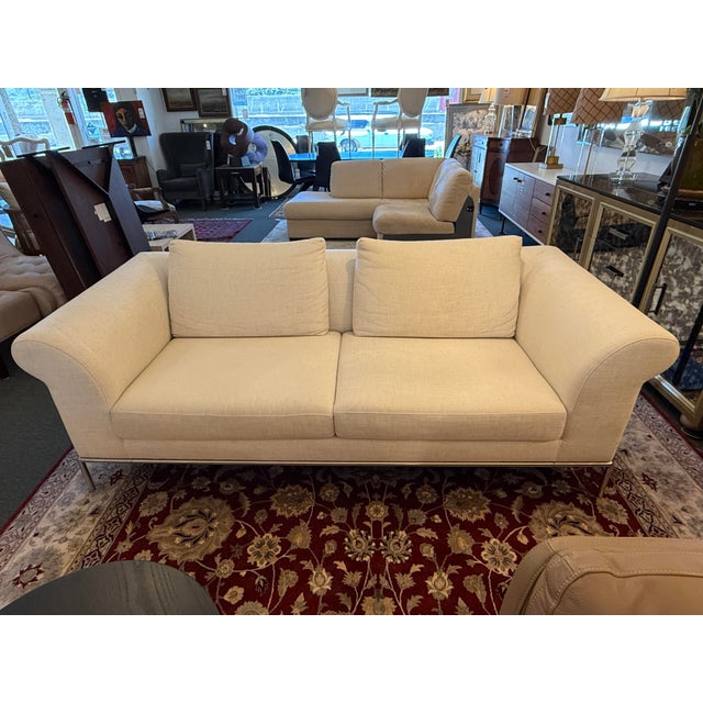 Design Plus Gallery presents a Contemporary Sofa of Linen from Natuzzi. This comfortable sofa has light tan upholstery of...