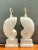 This pair of vintage plaster table lamps embodies mid-century modern sculptural design, their shell-form bodies spiraling...