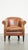 This very comfortable, elegant cowhide club chair with a loose seat cushion, timeless design and a warm color. This...