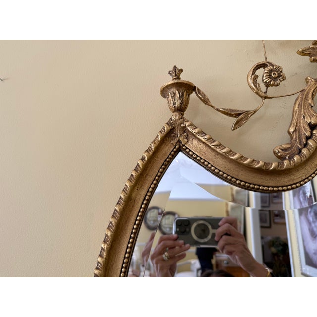 2020s Giltwood Neoclassical Shield Wall Mirror With Urn Crest and Ornate Ribbon Swag For Sale - Image 5 of 6