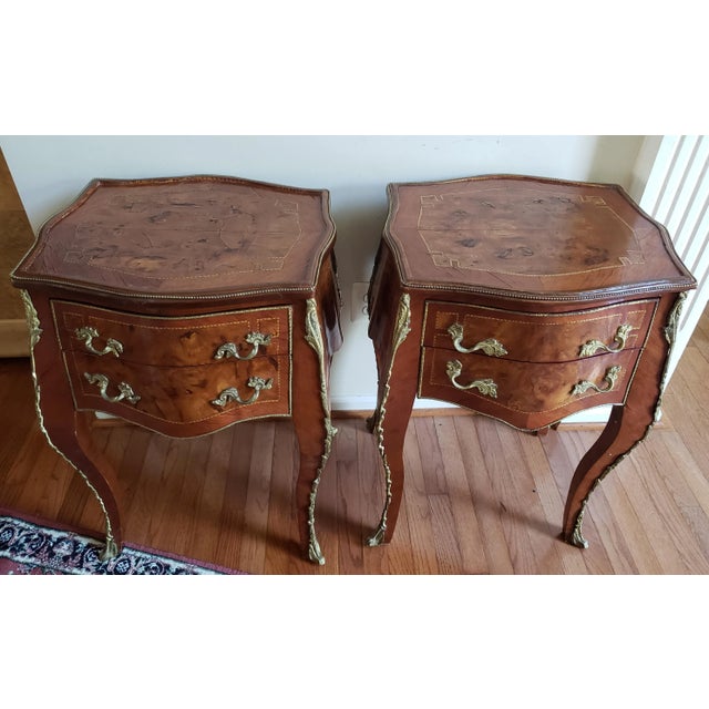 Pair of Louis XVI parquetry inlaid side table, with ormolu style bronze mounts. Each table measures 22" Wide x 19" Deep x...