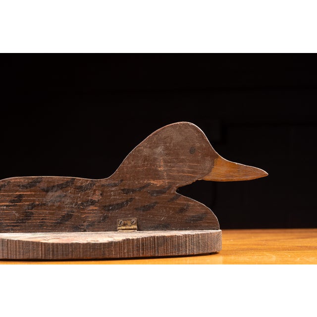 Vintage folding duck decoy, constructed of wood. 16"W x 7"D x 6"H. This duck decoy features a compact, foldable design...