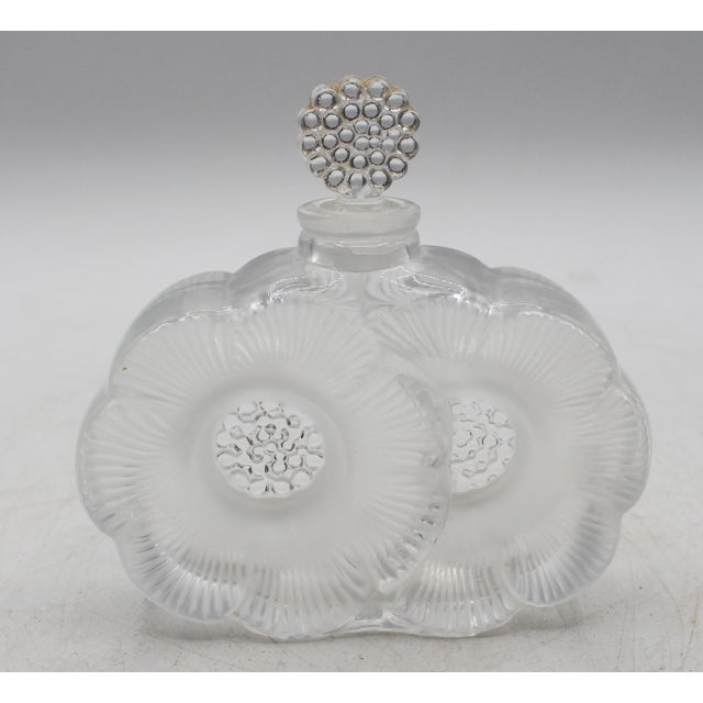 "Deux Fleurs" perfume bottle by Lalique, France, circa 1945-77. Design of 1935 by Rene Lalique. Two anemone flowers...