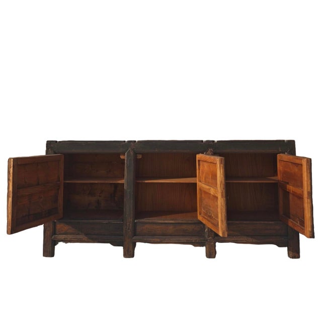 This late 19th century style sideboard and entertainment center is handmade using pine, featuring a weathered black finish...