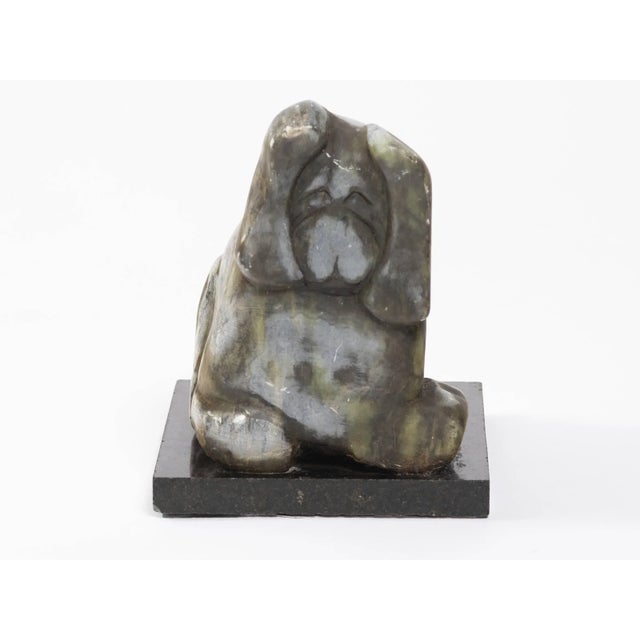 Signed carved marble sculpture of dog.