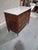 A handsome late 18th-century French Louis XVI period commode crafted in richly figured walnut and crowned with its...